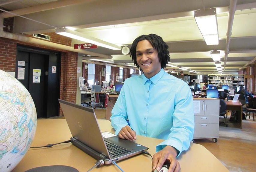 Student at computer in the library